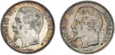 a silver coin with an image of a man ' s head on it