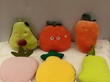 several stuffed fruits and vegetables are lined up on a table