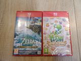 two nintendo wii games are sitting on a wooden table