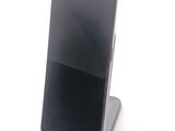 a cell phone that is sitting on top of a stand