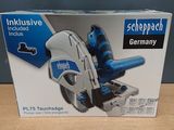 packaging of a blue and white circular saw on a wooden table