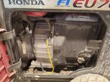 a close up of a small engine in the back of a truck