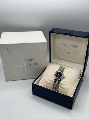 BREITLING, Montre bracelet de femme en acier à cadran à fond…