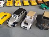 a lot of toy cars that are lined up on the floor