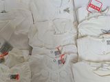 a lot of baby clothes on display in a store
