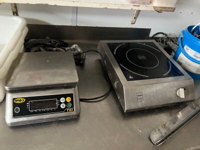 a stove and a blender on a counter in a kitchen