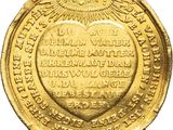 a close up of a gold coin with an eagle on it