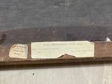 a piece of paper on a piece of wood that has a piece of paper attached to it