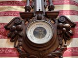a clock that is on the wall on the bed
