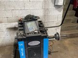a machine that is sitting on the ground next to a wall