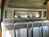 a view of the inside of a van with the sun shining through the window