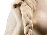 statue of a woman with a braided hair holding a flower