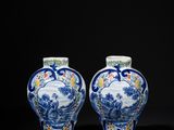 pair of blue and white vases with figures in a landscape