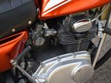 a close up of a motorcycle with a red and black engine