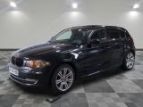 a picture of a black bmw suv parked in a garage