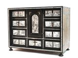 a black and white chest of drawers with pictures on it