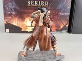 statue of a man on a horse with a sword in front of a video game box