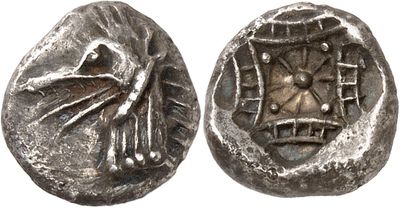 a close up of a coin with a bird on it