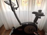 a stationary exercise bike in the corner of a room