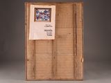 a wooden box with a picture on it and a sign attached to it