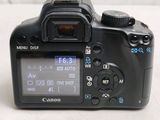 a digital camera that is sitting on a table