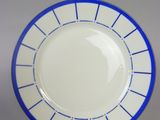 a blue and white plate that is on a table