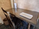 a table with a plate on it and a phone on top of it