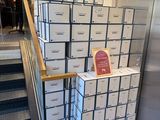 a stack of boxes sitting on the stairs of a building