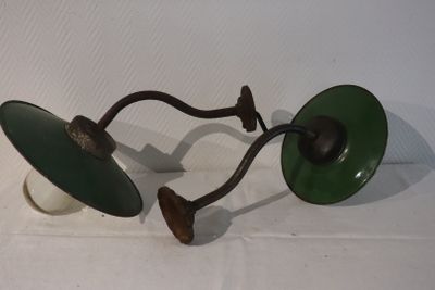 two green lamps that are on a white table