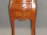 an image of a small chest of drawers with a marble top