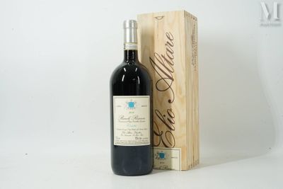 a bottle of wine sitting next to a wooden box