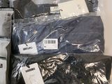 a pile of men ' s clothing in a plastic bag