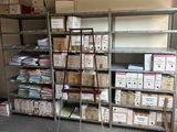 a room with many boxes and a ladder in it
