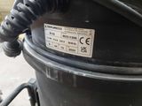 a close up of a black trash can with a label on it