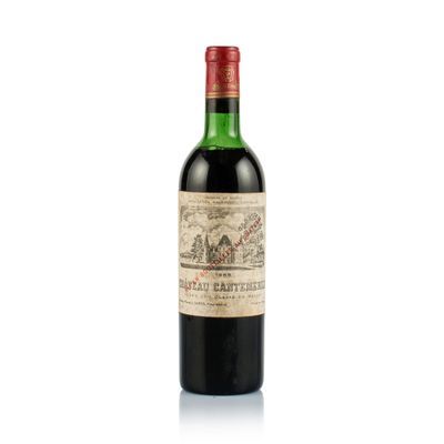 a bottle of wine sitting on top of a white surface