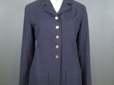 an image of a woman ' s jacket on a mannequin stand