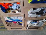 a carton of clothes that is sitting on the street
