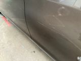 a close up of a car door with a hole in the side