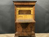 an old wooden desk with a shelf on top of it