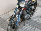 a motorcycle parked on the side of the street