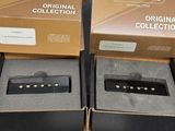 Deux boîtes de micros Gibson sont posées sur une table, avec une étiquette de prix