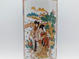 a vase with a picture of a woman and a man on it