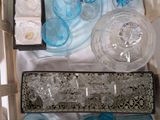 a lot of glassware in a box on a table