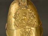 helmet of a person with a shield and a sword on a black background