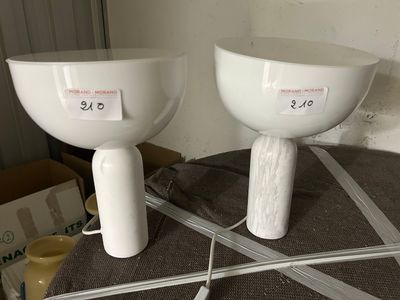 two white bowls on a table with a price tag on them