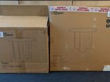 two boxes that are sitting on the floor next to each other