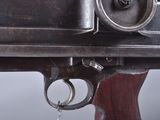 a close up of a gun with a key on it