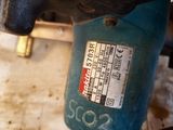 a close up of a drill with a label on it