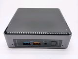 an image of a small computer with a usb attached to it ' s side