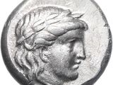 a close up of a coin with a woman ' s head on it